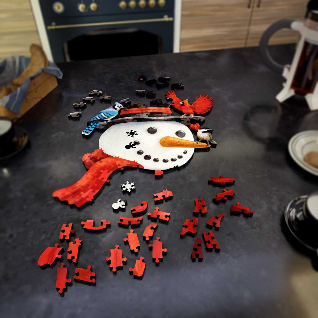 Fathom Puzzles Frosty Landing - Snowman with Birds Cardinal, Bluejay, Chickadee Lifestyle Wooden Laser Cut Jigsaw 200 Pieces Geoff Cota