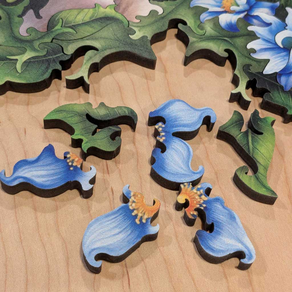 Fathom Puzzles Hard to Spot Wooden Laser Cut Jigsaw Puzzle 200 pieces Geoff Cota Leopard surrounded by flowers Lifestyle shot of flower separated