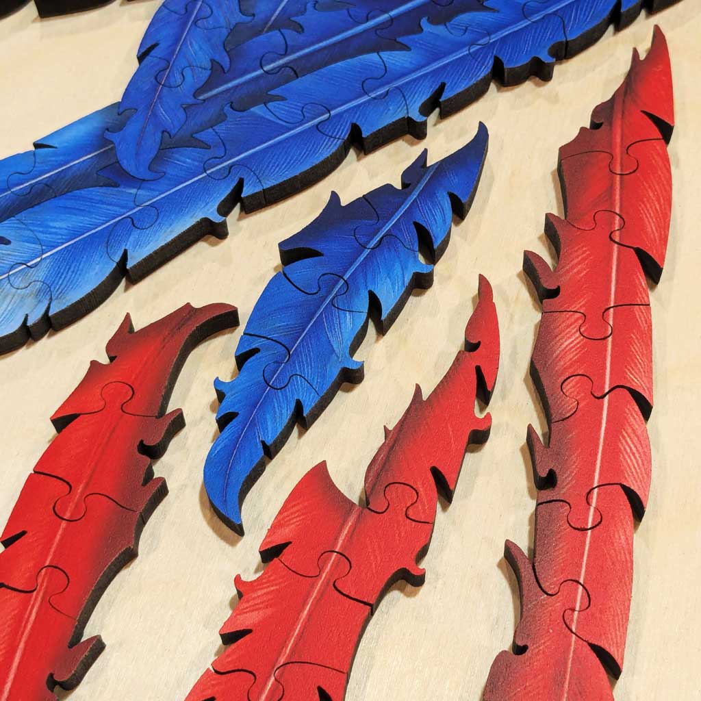 Close-up of precision-cut macaw feathers with crisp color separation